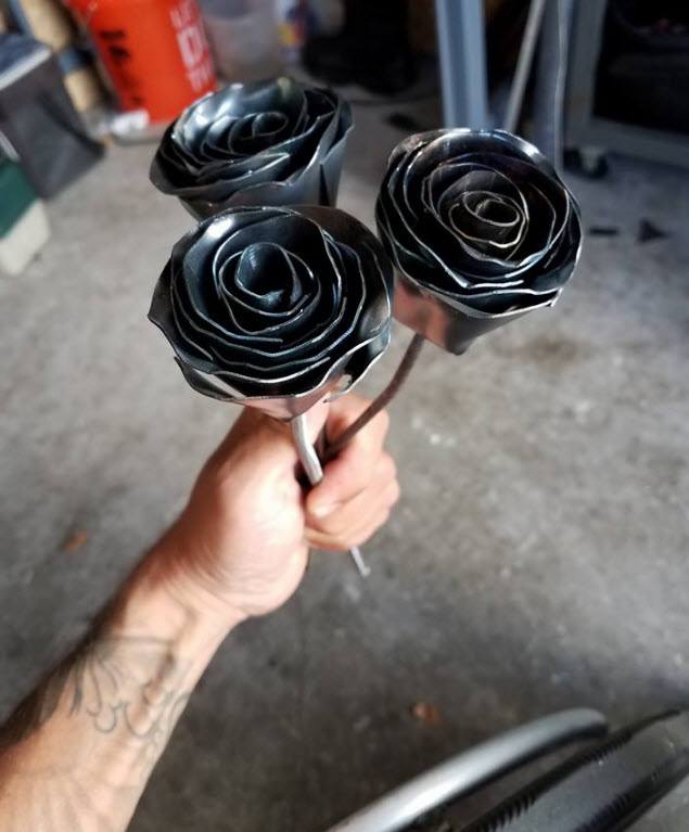 Jerry Diaz with some of his creations - metal roses