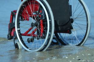 Wheelchair in edge of lake