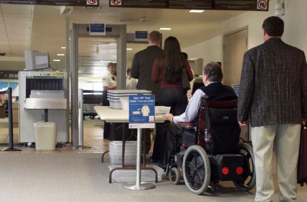 Wheelchair user at airport security checkpoint
