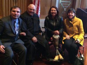 RespectAbility representatives pose with Senator Tammy Duckworth in January.