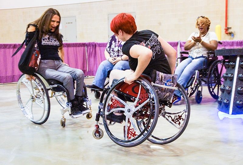 Abilities Expo "Dance Ambassador" teaches a freestyle dance workshop in Houston and dances with Colours Wheelchair Team Member Skyler Willis.