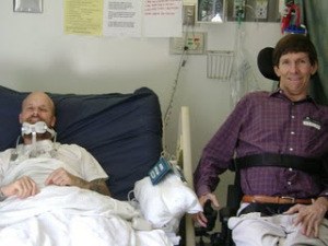 Cure Medical founder Bob Yant with patient who is struggling with paralysis like he does.