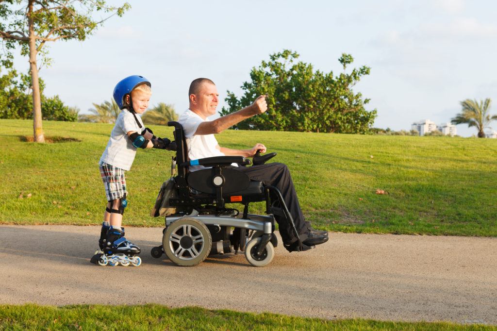 Father and son enjoy accessible playground