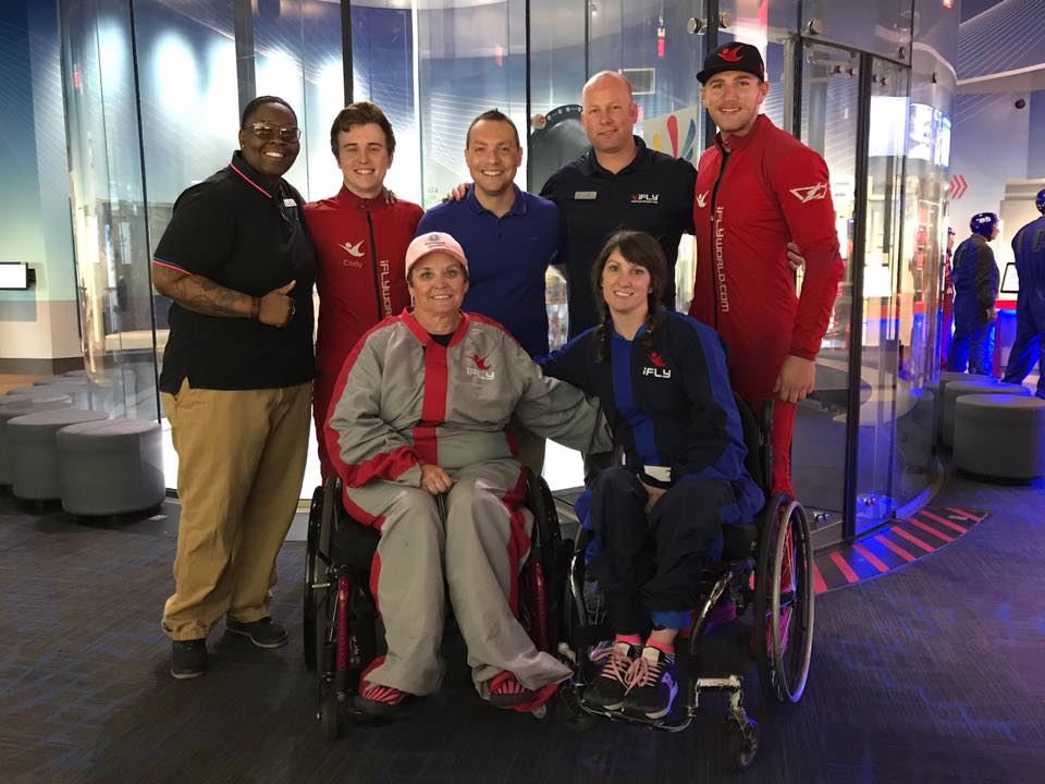 Cure Nation friend Kim Harrison (bottom left) doesn't let Transverse Myelitis stop her from soaring with iFly Atlanta!