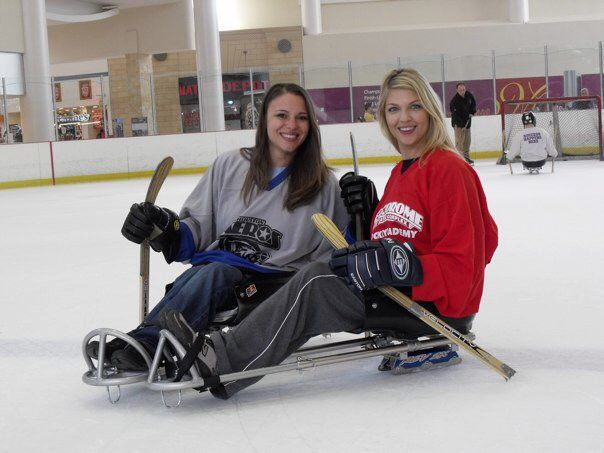 Two ladies in a hockey rink