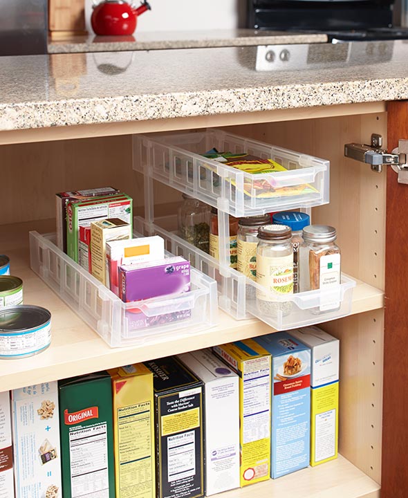 Overhauling your cabinets to make adjustable, slide-out shelves can be expensive, and a big project to take on.  That's why we were thrilled to find these sliding cabinet storage options that sit on your shelves and slide out to give you better access to household goods.