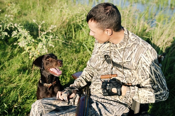 Chad Waligura with his hunting dog