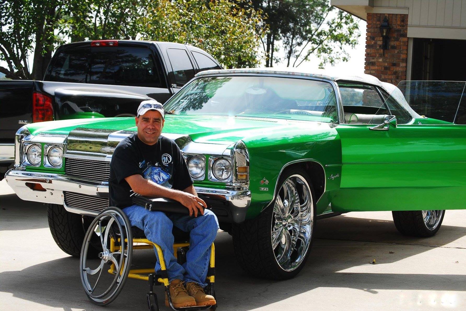 Daniel Ruiz says, "At my home in Alabama just after moving from Miami,Fl. This is a 1972 Chevy Impala that I had built from the ground up with all the bells and whistles a person with disability could wish for.