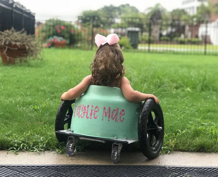 This is Kaylie Mae! She is 2 years old and has   Spina   Bifida  and Hydrocephalus. This picture was taken at Myrtle Beach on a family vacation during a rainy day.