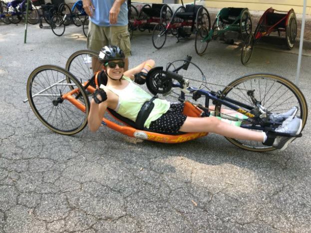 Brittany Perdue says "This was me in a para triathlon where I did 75 yard swim, 5 mile hand cycle, and a 2 mile racing wheelchair."