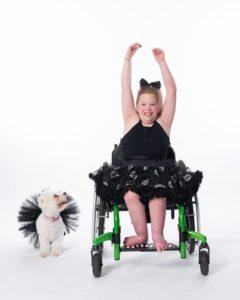 ballerina in wheelchair with matching dog