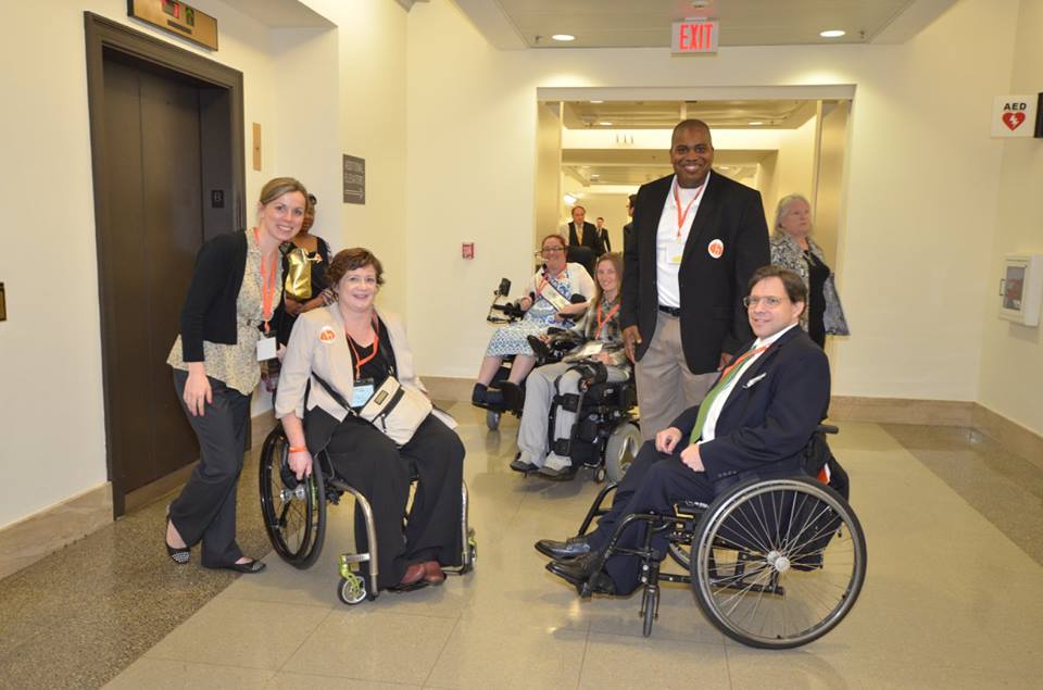 disability advocates near elevator visiting policy makers