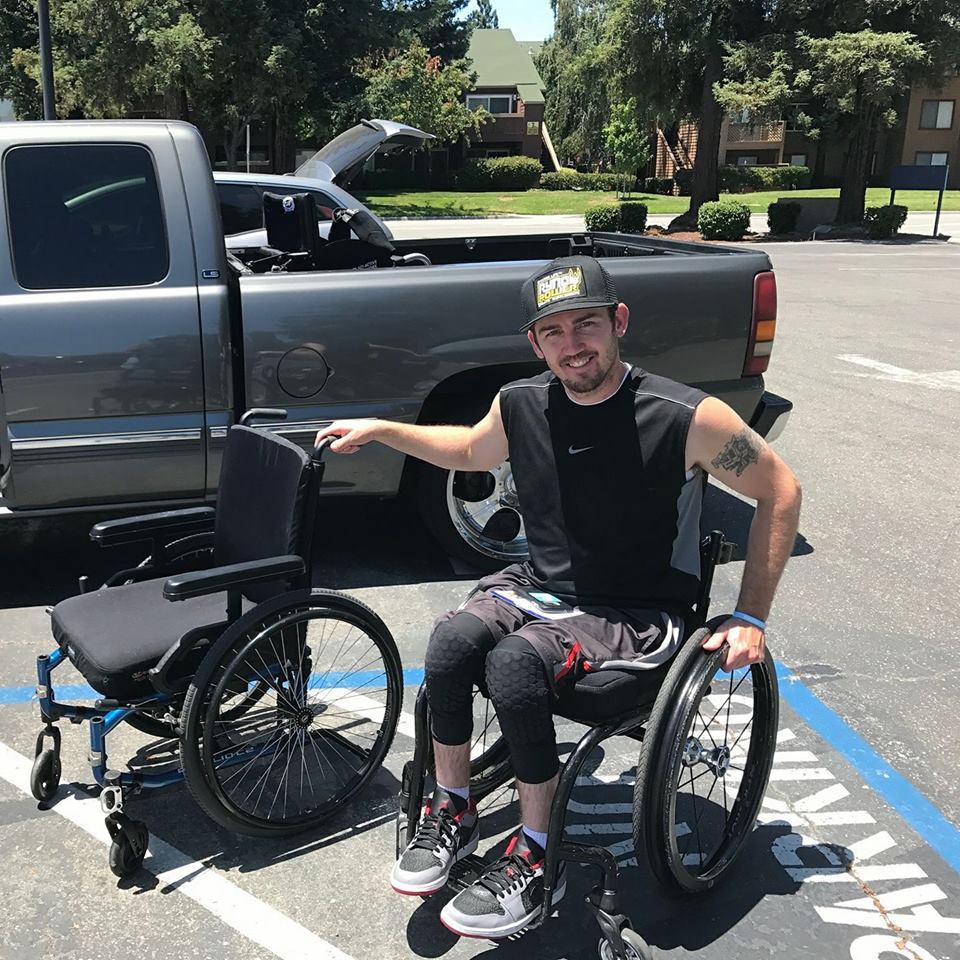 wheelchair user troy plunked delivers a wheelchair for his share-a-chair program