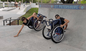 two wheelchair users on skate ramp